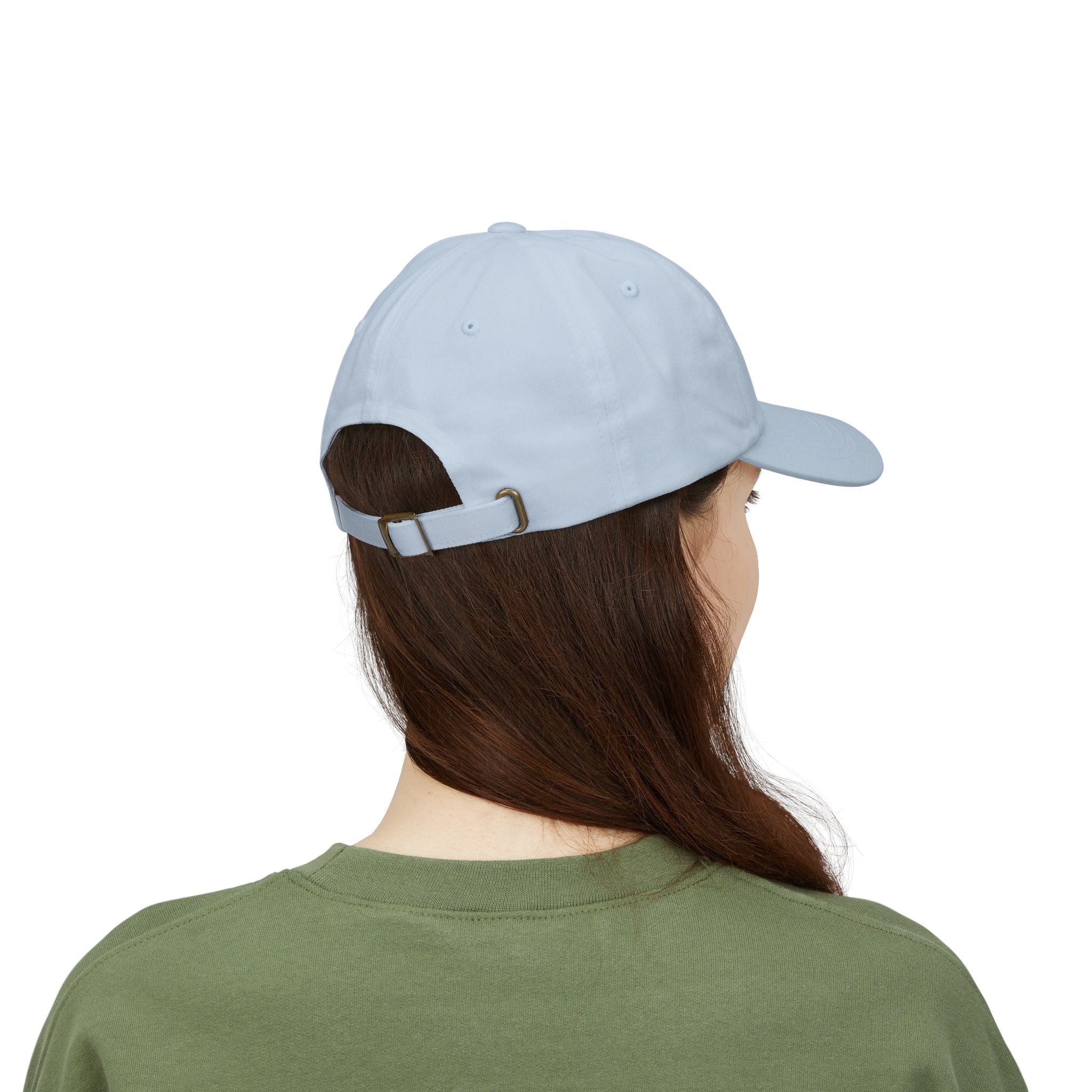 TUCURUCU Daily Walk Cap in light blue cotton with an adjustable antique-brass buckle strap, shown from the back.