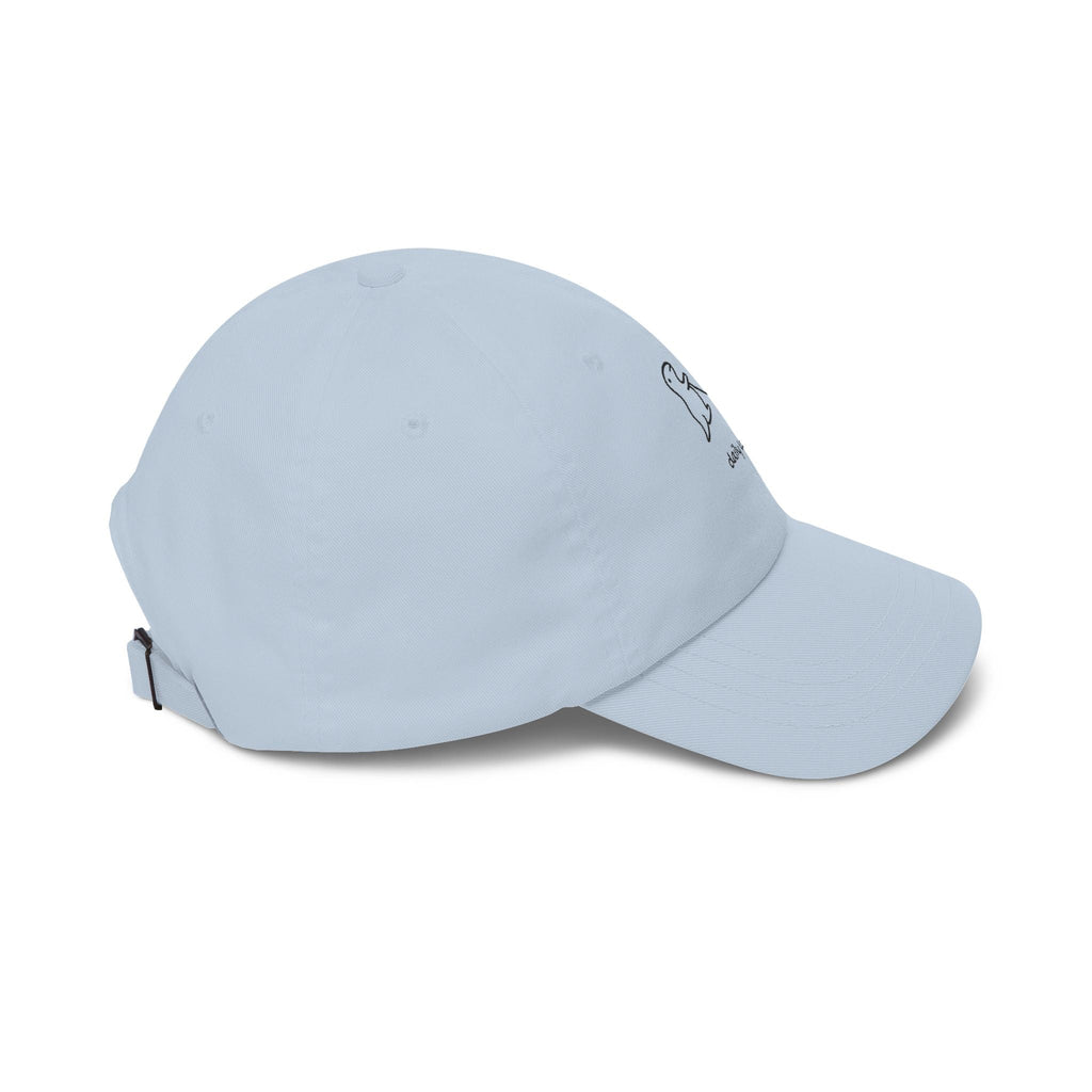 TUCURUCU light blue unstructured cotton baseball cap with a small embroidered dinosaur and dog daily walk design.