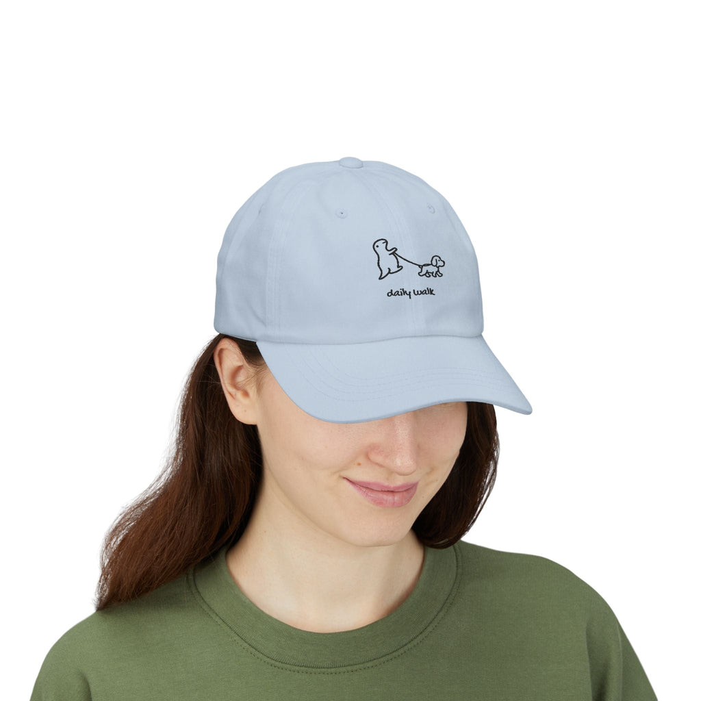 TUCURUCU light blue unstructured cotton baseball cap with a cute embroidered dino and dog daily walk design.